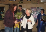 Collin presents a bouquet to Pam Mc Intyre, watched by Glenelg Shire Mayor Councillor Karen Stephens (right)